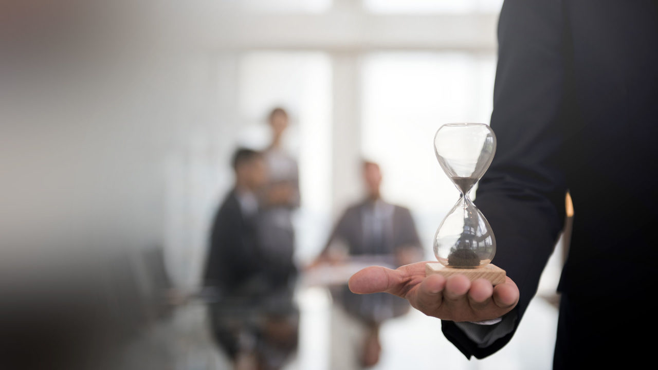 businessman-holding-hour-glass-signifies-importance-being-time-1280x720.jpg